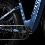 A close up of the front wheel on an electric bike.