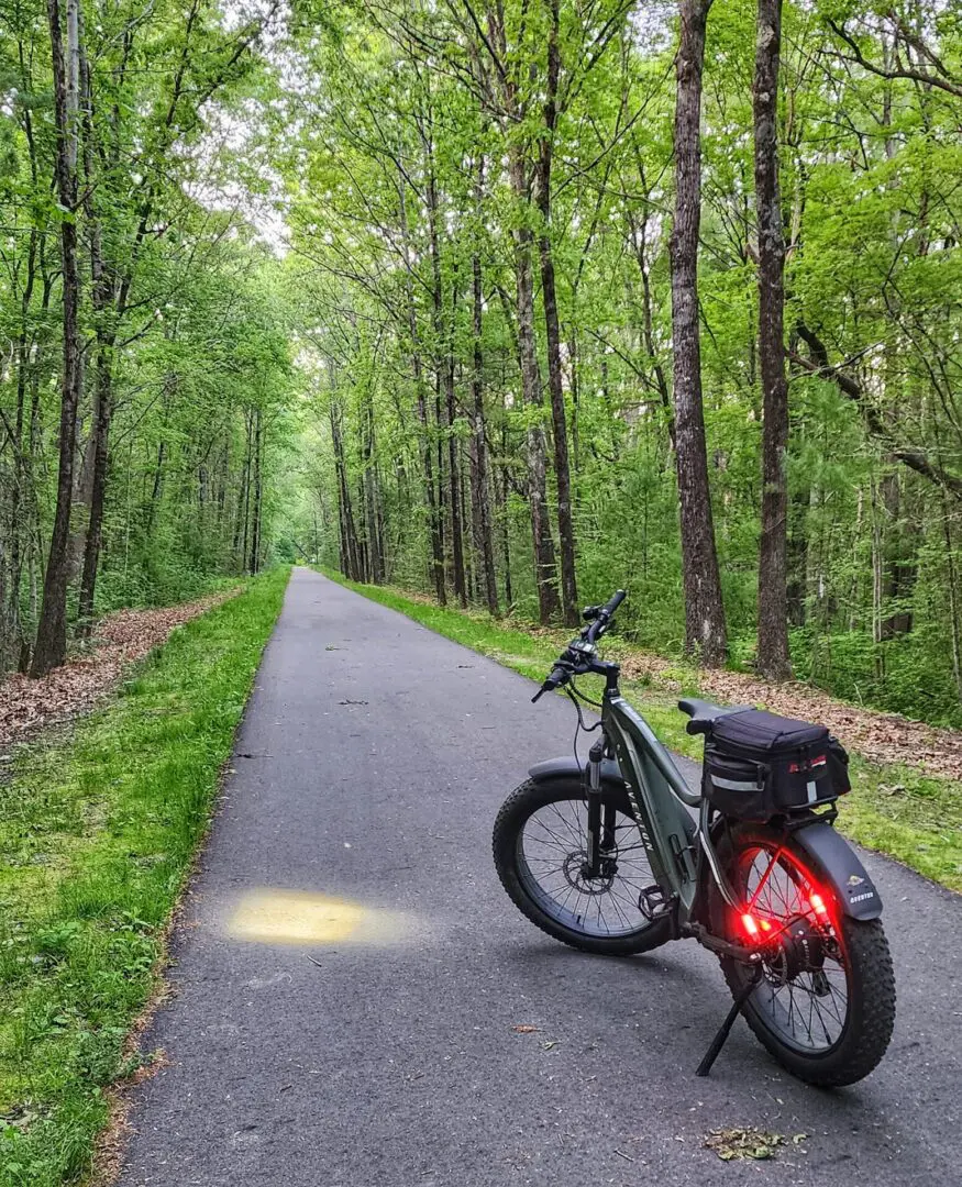 A bicycle parked on the side of a road.